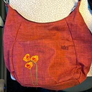 Haiku embroidered bag, made from recycled plastic.